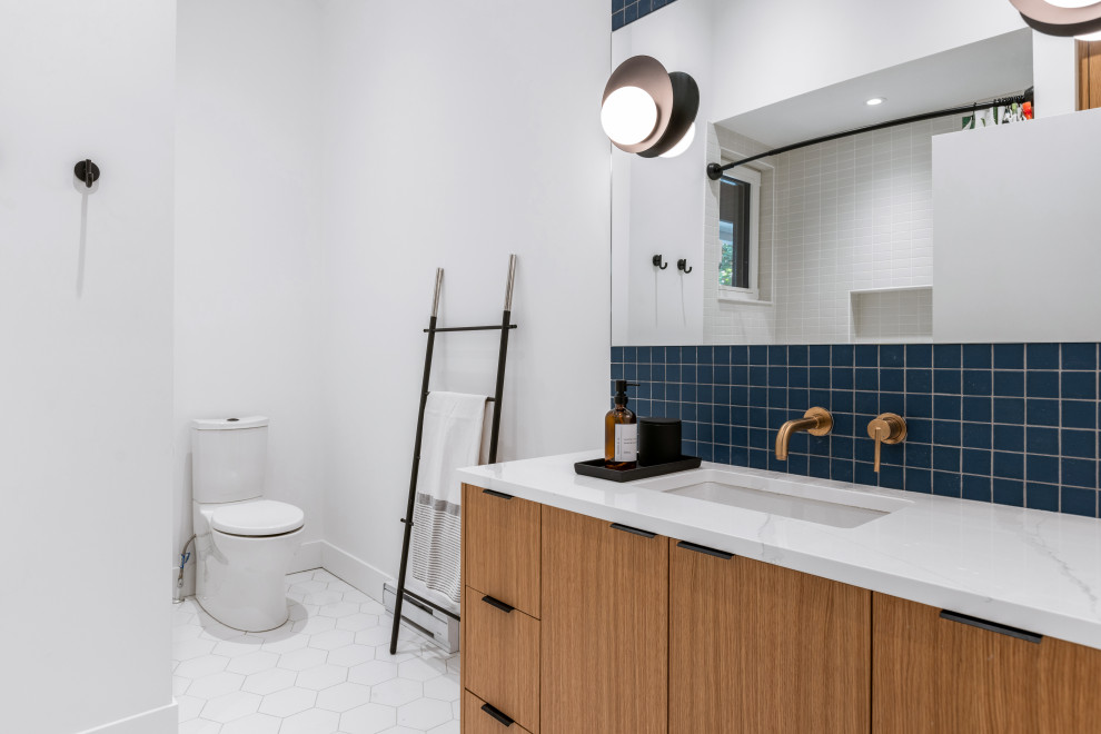 Inspiration for a small contemporary shower room bathroom in Vancouver with flat-panel cabinets, light wood cabinets, blue tiles, mosaic tiles, white walls, a built-in sink, engineered stone worktops, a shower curtain, white worktops, a single sink and a built in vanity unit.