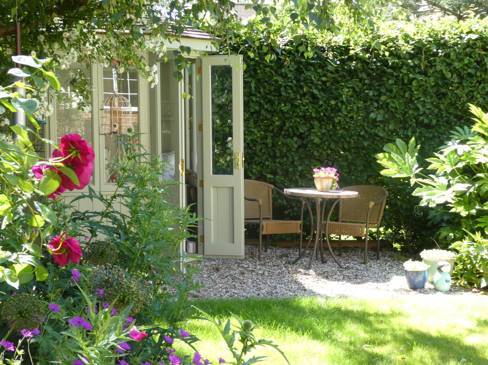This is an example of a mid-sized contemporary backyard full sun garden in Cheshire.
