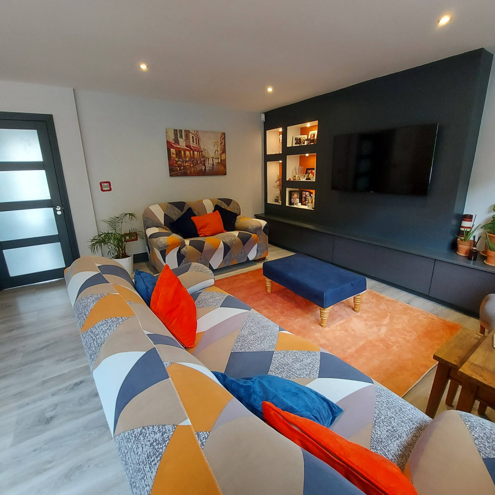 Inspiration for a large modern open plan living room in Dublin with light hardwood flooring, grey floors and multi-coloured walls.