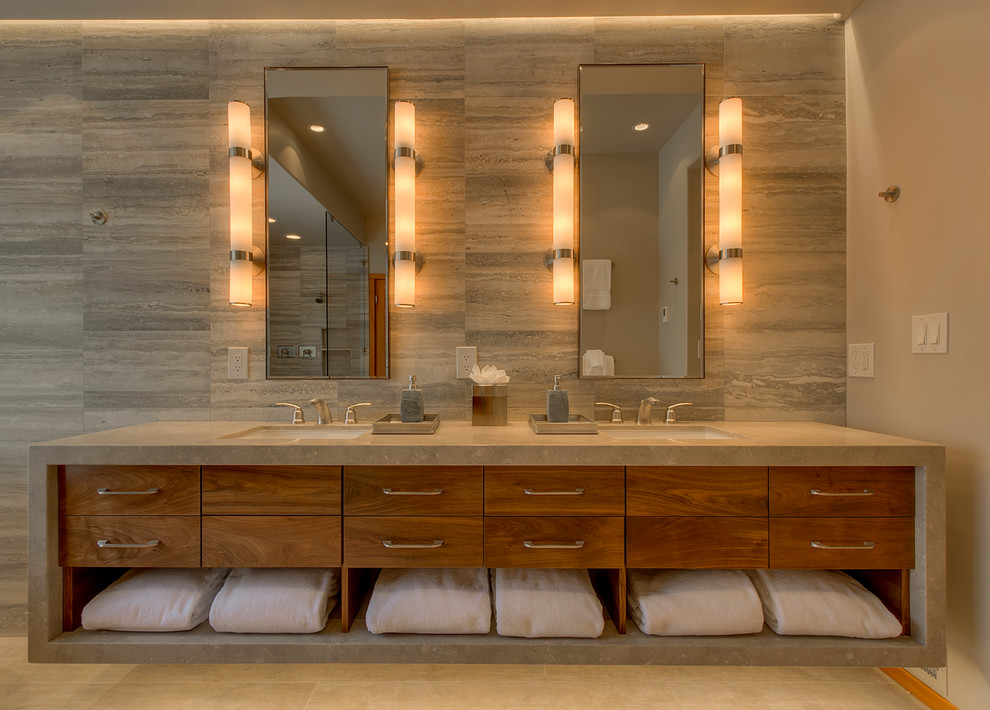 Inspiration for a modern master bathroom in Sacramento with an undermount sink, flat-panel cabinets, medium wood cabinets, limestone benchtops, a freestanding tub, a curbless shower, a two-piece toilet, gray tile, stone tile, grey walls and ceramic floors.