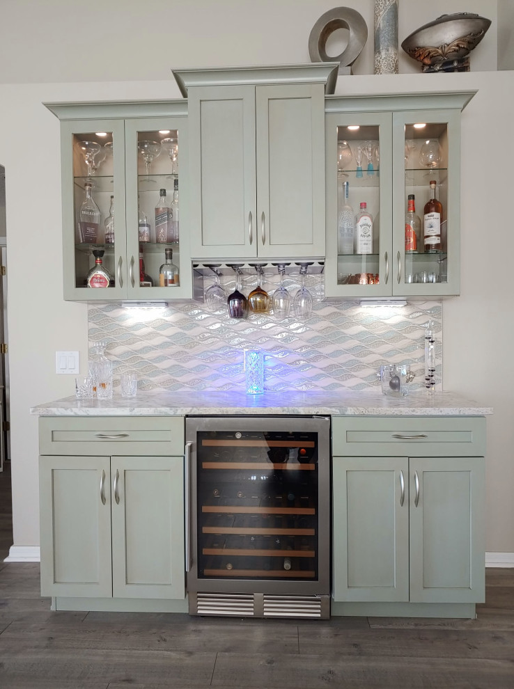 Design ideas for a small classic galley dry bar in Tampa with shaker cabinets, green cabinets, quartz worktops, multi-coloured splashback, glass tiled splashback and grey worktops.