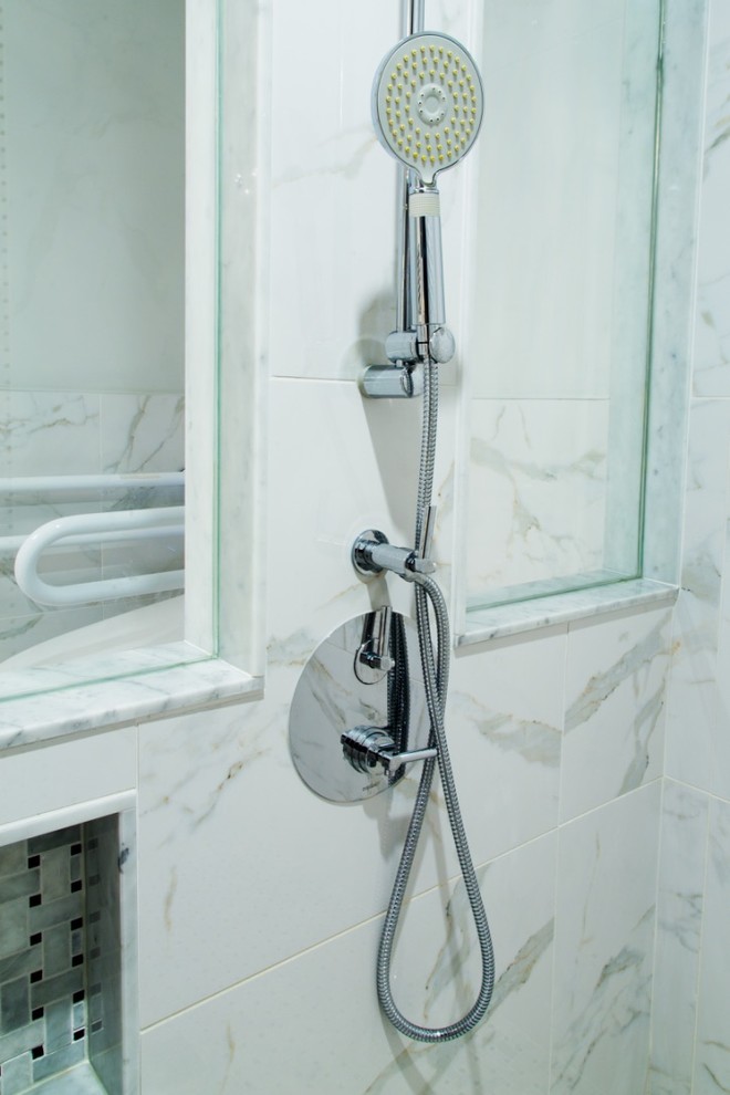 Inspiration for a large transitional master gray tile, white tile and stone tile marble floor home design remodel in Toronto with shaker cabinets, blue cabinets, a one-piece toilet, white walls, an undermount sink and solid surface countertops