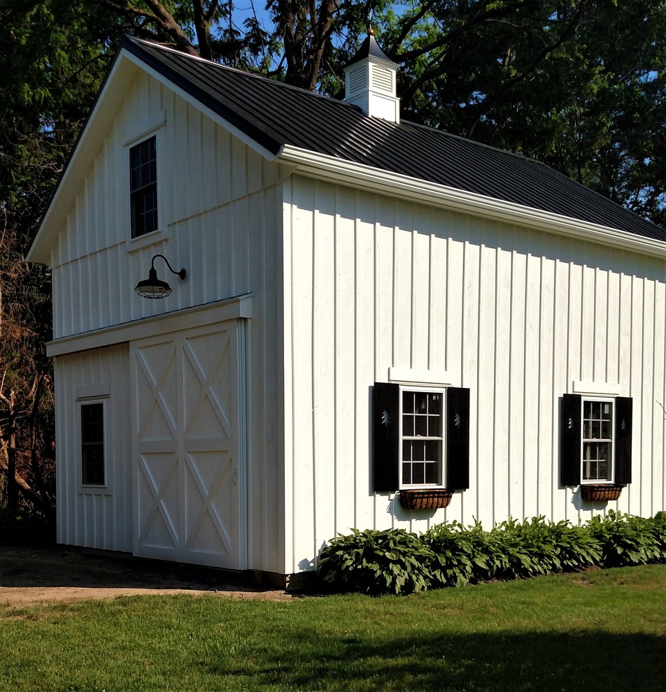 Mid-sized farmhouse detached garage workshop photo