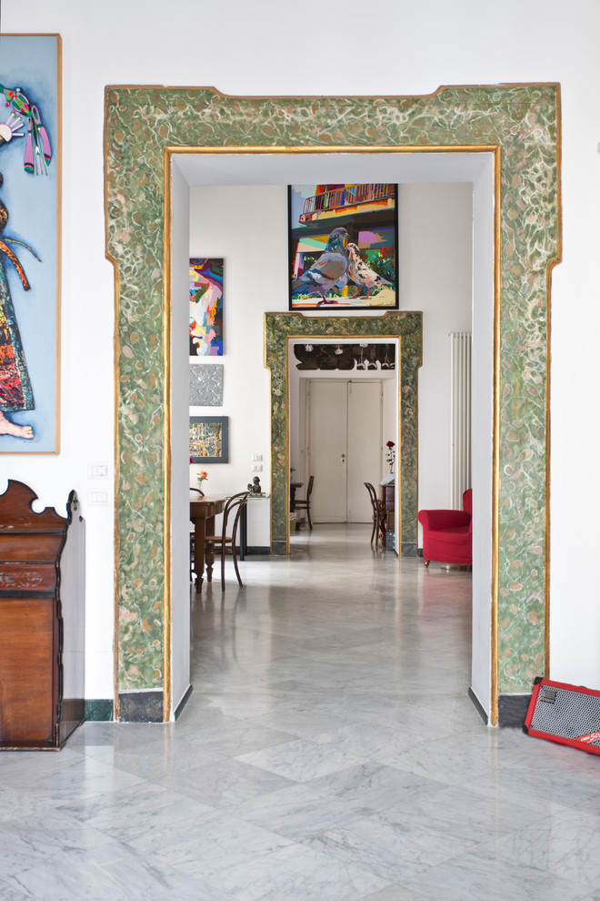 Design ideas for an eclectic hallway in Naples with white walls and marble floors.