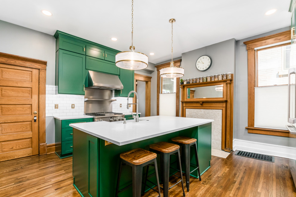 Inspiration for a large timeless eat-in kitchen remodel in Columbus with a farmhouse sink, shaker cabinets, green cabinets, quartz countertops, white backsplash and an island
