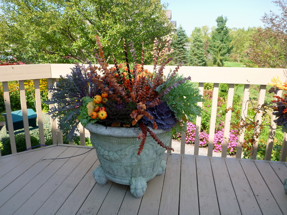 Example of a small mountain style backyard balcony deck design in Chicago with no cover