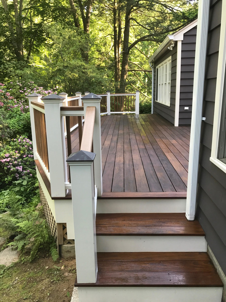 Example of a mid-sized transitional backyard deck design in New York with no cover