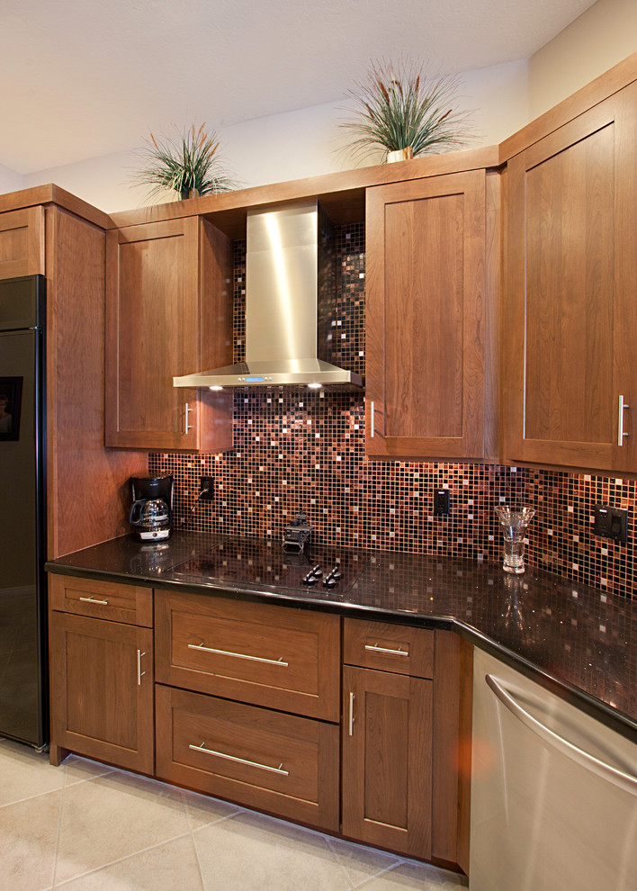 Large transitional ceramic tile eat-in kitchen photo in Phoenix with an undermount sink, flat-panel cabinets, dark wood cabinets, quartz countertops, multicolored backsplash, mosaic tile backsplash, black appliances and no island