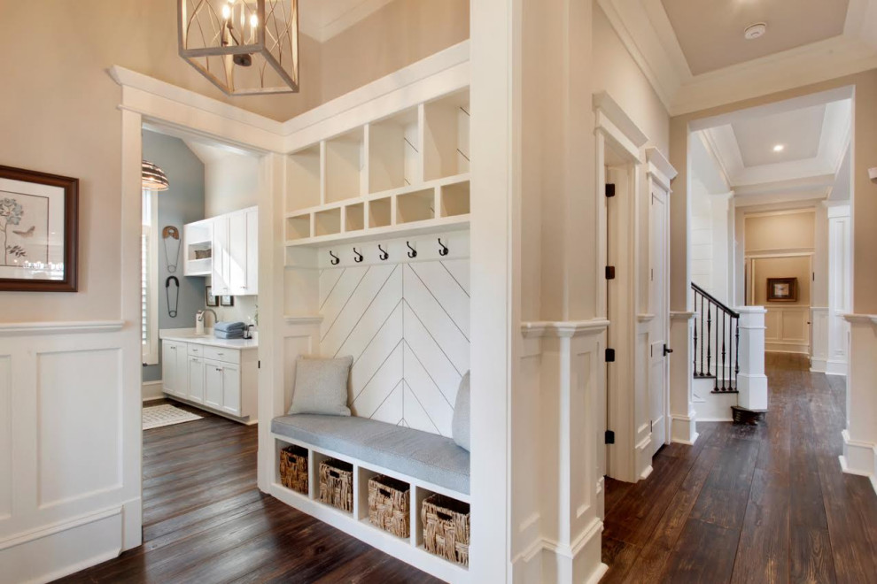 Inspiration for a country dark wood floor and brown floor mudroom remodel in Atlanta with beige walls