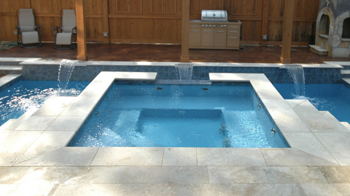 Hot tub - large transitional backyard concrete paver and rectangular hot tub idea in Chicago
