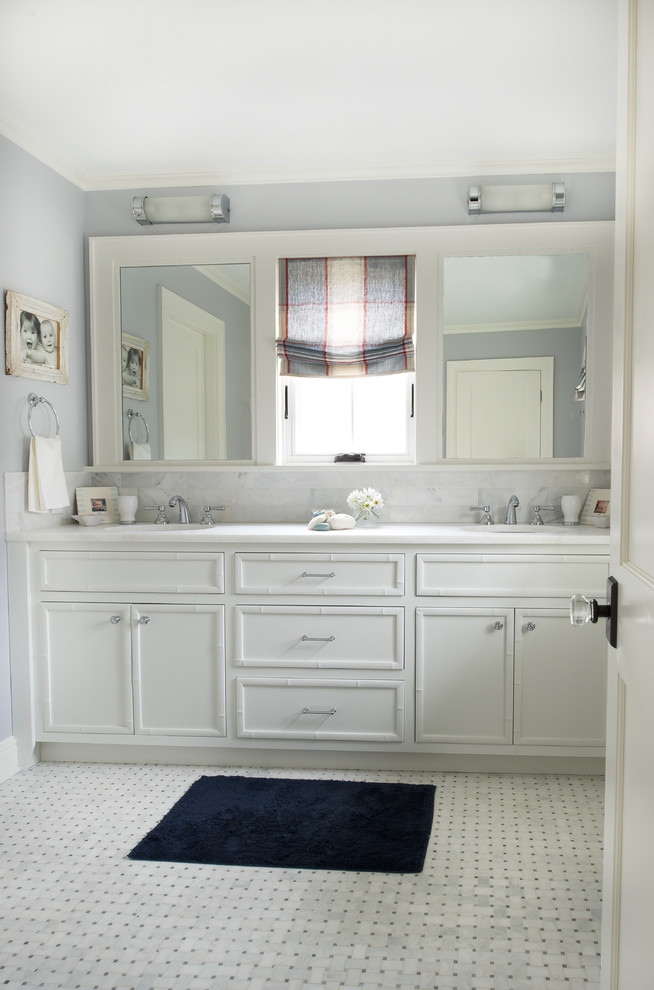 Mid-sized transitional kids bathroom in DC Metro with white cabinets, an alcove shower, gray tile, white tile, grey walls, an undermount sink, marble benchtops, recessed-panel cabinets, matchstick tile, ceramic floors and white floor.