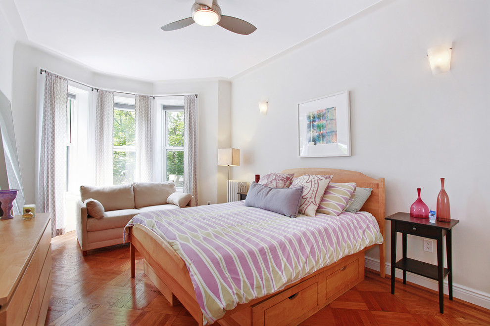 Inspiration for a transitional bedroom in New York with medium hardwood floors.