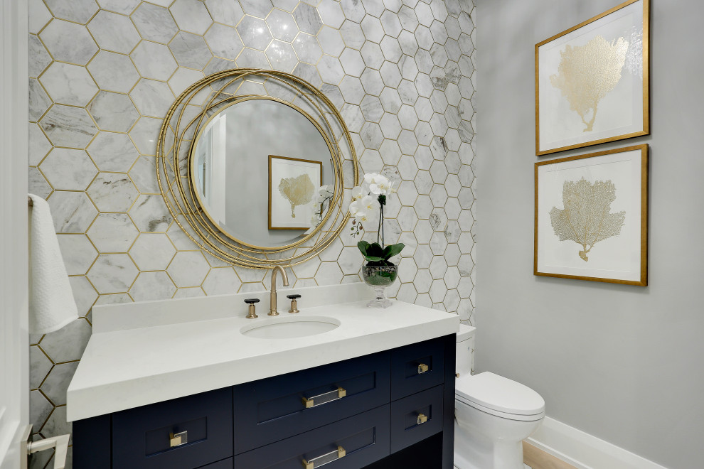 Design ideas for a large transitional powder room in Miami with blue cabinets, gray tile, engineered quartz benchtops and a freestanding vanity.