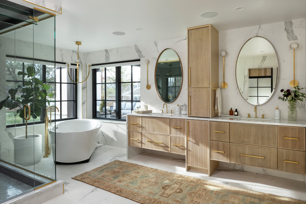 Inspiration for a classic ensuite bathroom in Denver with a freestanding bath, a corner shower, a hinged door and double sinks.