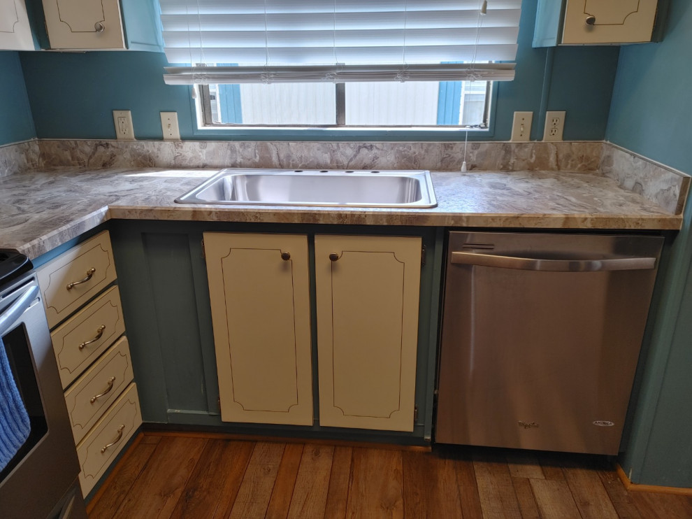 Kitchen - mid-sized kitchen idea with white cabinets, laminate countertops, an island and beige countertops