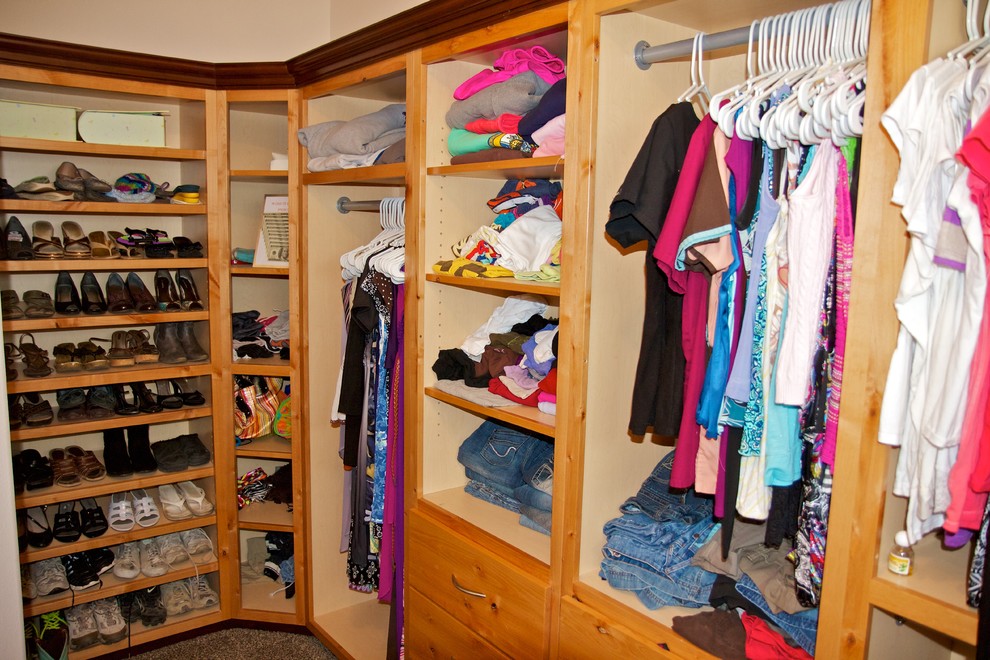 Walk-in closet - mid-sized women's carpeted walk-in closet idea with light wood cabinets