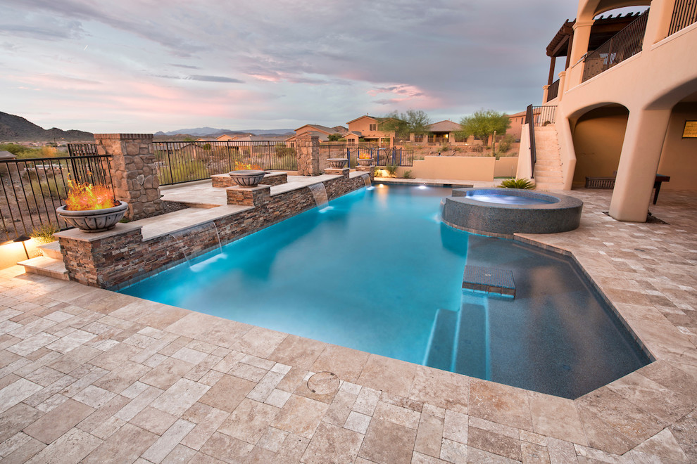 Pool fountain - large modern backyard stone and custom-shaped pool fountain idea in Phoenix