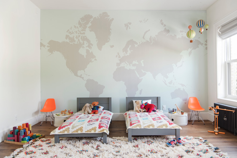 Photo of a large transitional gender-neutral kids' bedroom for kids 4-10 years old in Raleigh with multi-coloured walls, medium hardwood floors and brown floor.