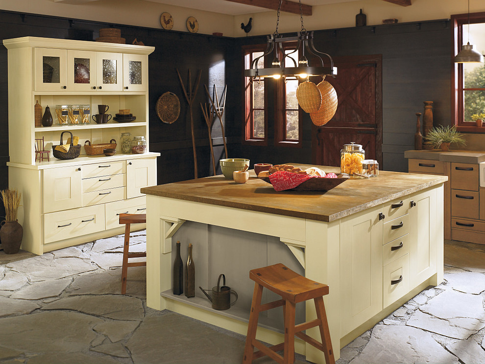 Example of a large mountain style eat-in kitchen design in Edmonton with a farmhouse sink, flat-panel cabinets and an island