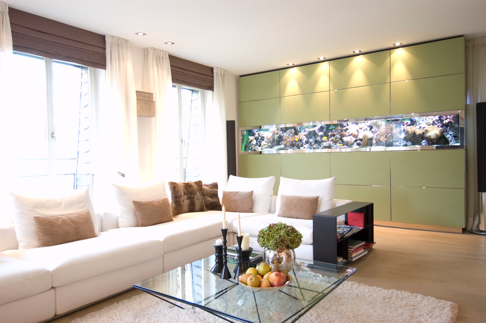 This is an example of a large contemporary family room in Frankfurt with light hardwood floors.