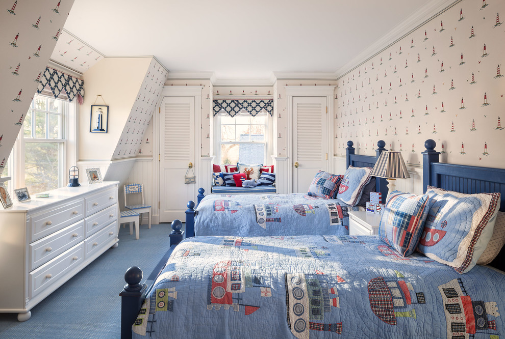 This is an example of a beach style kids' bedroom for kids 4-10 years old and boys in Portland Maine with carpet and blue floor.