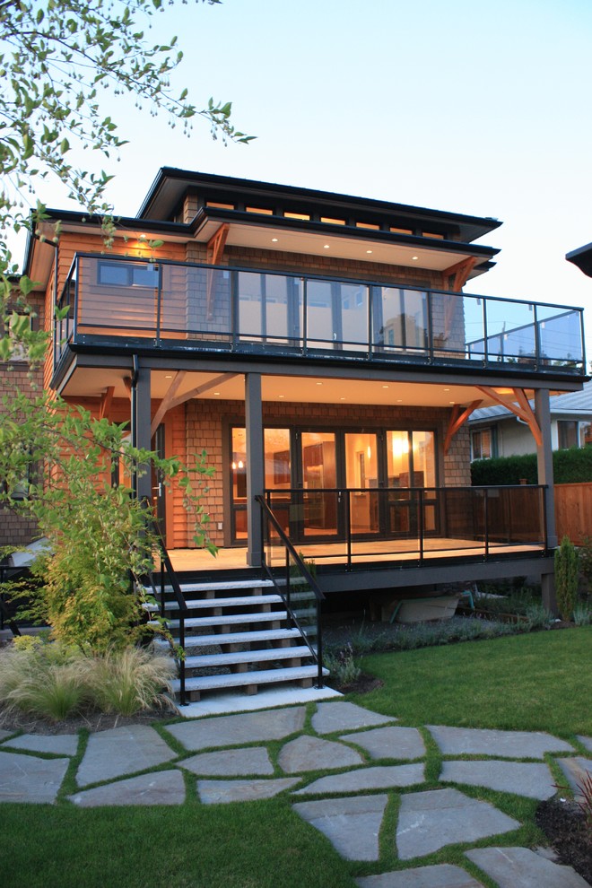 Contemporary two-storey exterior in Vancouver with wood siding.
