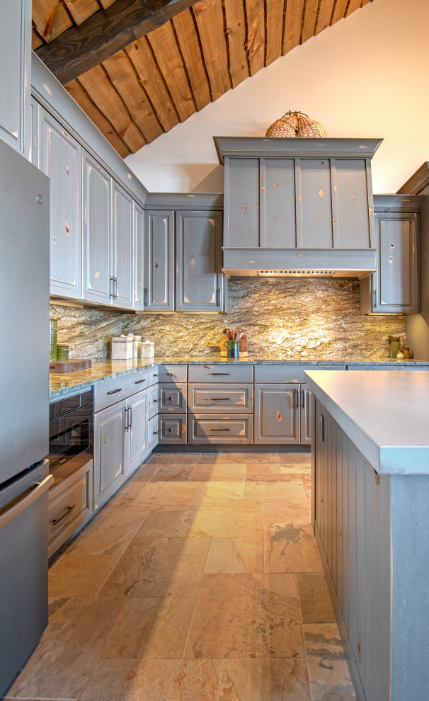 Example of a mountain style wood ceiling eat-in kitchen design with granite countertops, granite backsplash, raised-panel cabinets, distressed cabinets, multicolored backsplash, stainless steel appliances, an island and multicolored countertops