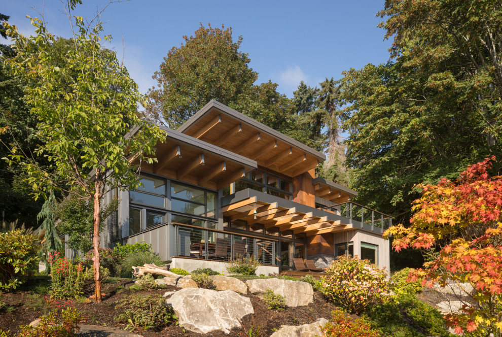 Large modern two-storey brown house exterior in Seattle with a flat roof.