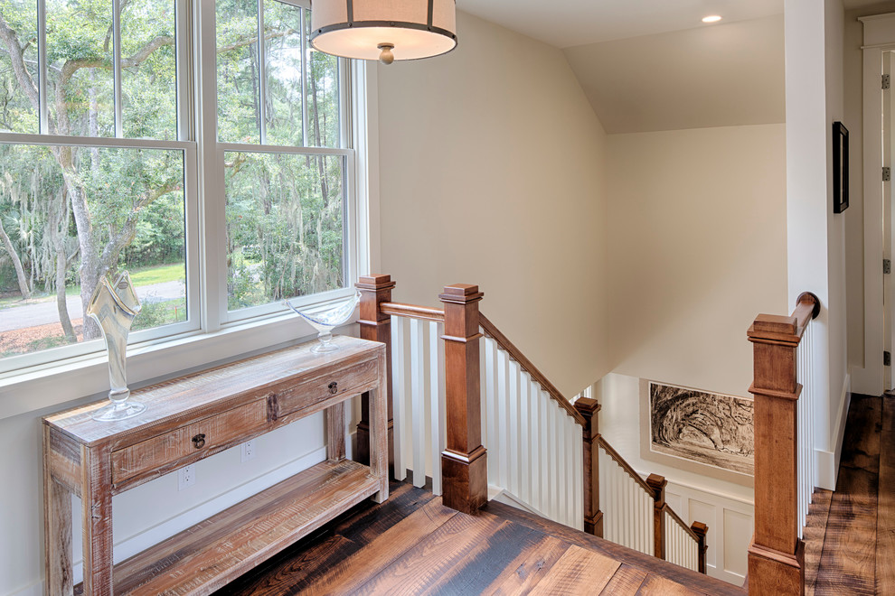 Mid-sized country wood straight staircase in Grand Rapids with painted wood risers.