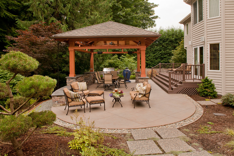 Design ideas for a large traditional backyard patio in Seattle with an outdoor kitchen, concrete slab and a gazebo/cabana.