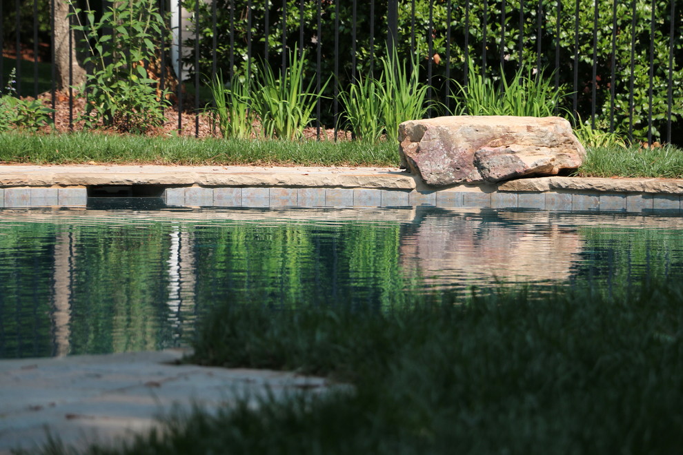 Inspiration for a large rustic backyard concrete paver and custom-shaped natural hot tub remodel in Raleigh