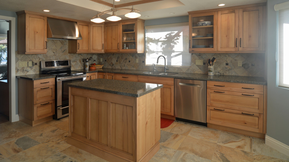Mid-sized country u-shaped open plan kitchen in San Luis Obispo with an undermount sink, shaker cabinets, light wood cabinets, quartz benchtops, green splashback, stone tile splashback, stainless steel appliances, travertine floors, with island, beige floor, brown benchtop and recessed.