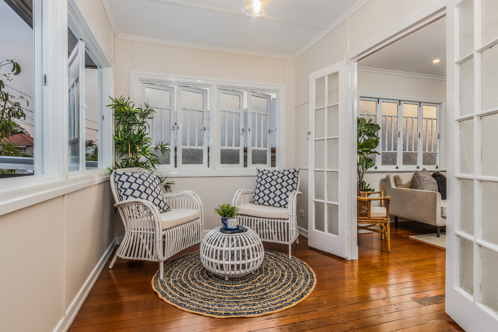 Design ideas for a traditional sunroom in Brisbane with medium hardwood floors, a standard ceiling and brown floor.