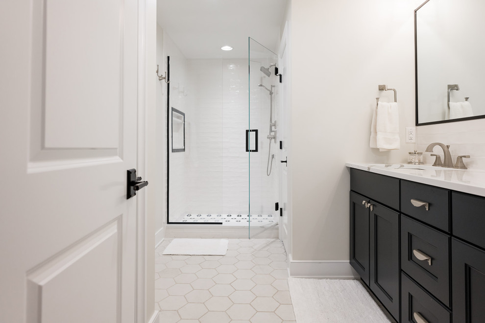 Photo of a mid-sized contemporary master wet room bathroom in Indianapolis with white walls, medium hardwood floors, an undermount sink, granite benchtops, a hinged shower door, white benchtops, a single vanity and a built-in vanity.