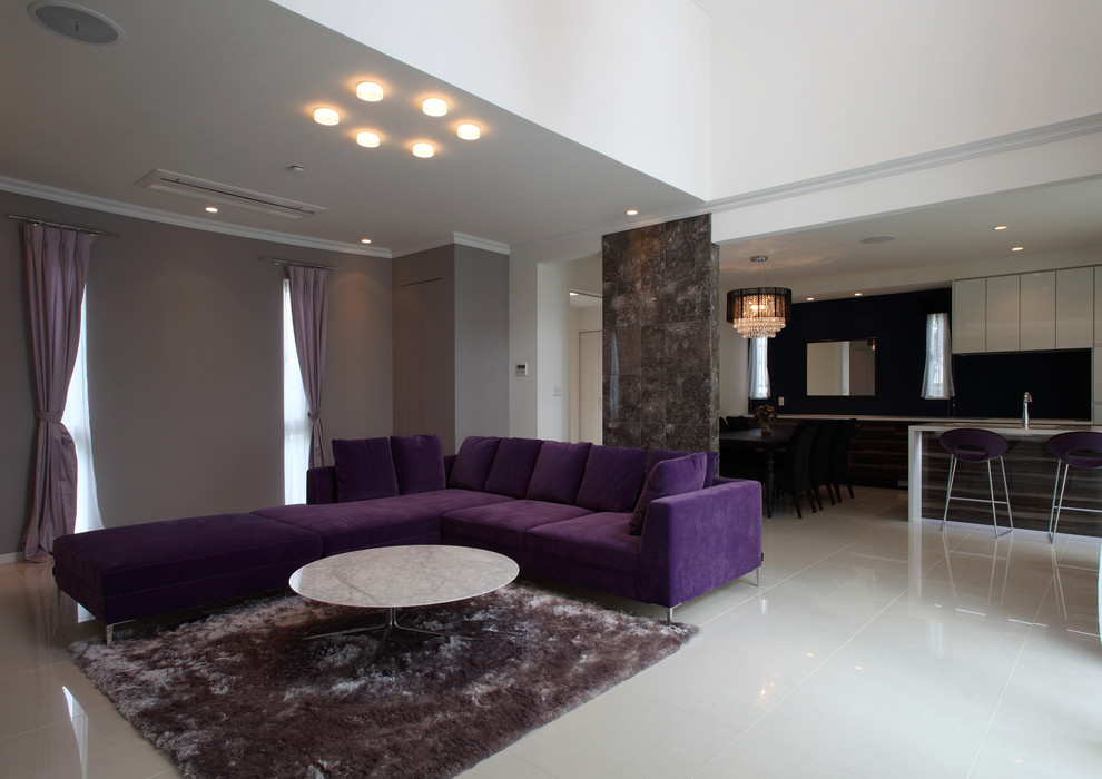 This is an example of a contemporary open concept living room in Yokohama with grey walls, marble floors and beige floor.