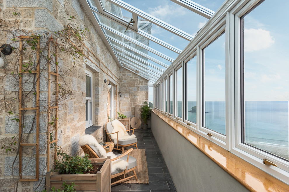 Design ideas for a beach style sunroom in Cornwall.