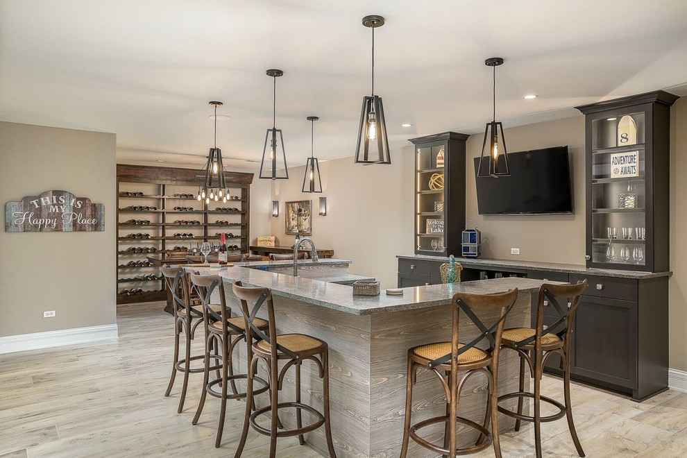 Inspiration for a large contemporary u-shaped wet bar in Chicago with shaker cabinets, dark wood cabinets, granite benchtops, porcelain floors and beige floor.
