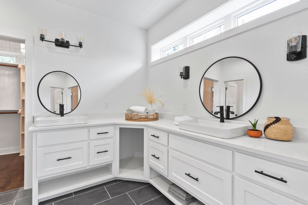 Mid-sized country master bathroom in Kansas City with recessed-panel cabinets, white cabinets, an alcove shower, a two-piece toilet, white walls, ceramic floors, a vessel sink, engineered quartz benchtops, grey floor, a hinged shower door, white benchtops, an enclosed toilet, a double vanity and a built-in vanity.