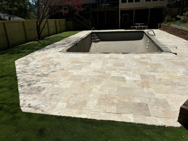 Laid pavers with Sand to lock them into place.....JUST GREAT!