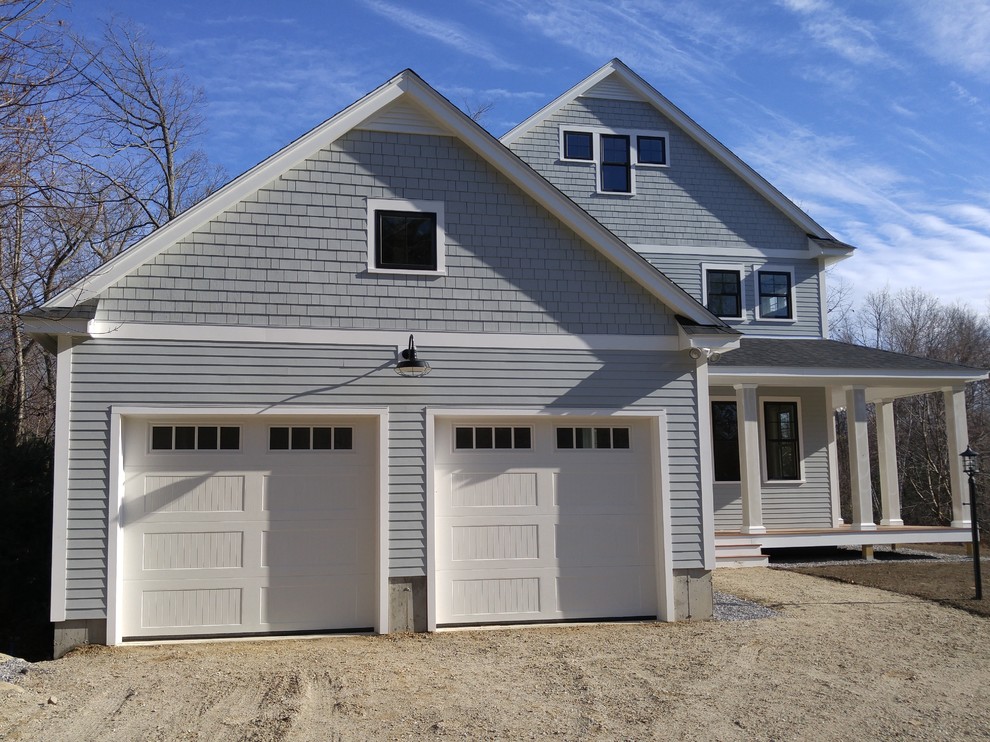 Mid-sized traditional two-storey grey exterior in Boston with wood siding and a gable roof.