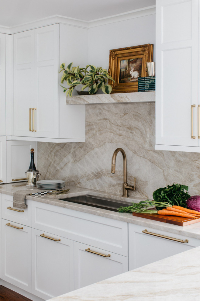 Inspiration for a large transitional dark wood floor and brown floor eat-in kitchen remodel in Chicago with an undermount sink, recessed-panel cabinets, white cabinets, quartzite countertops, beige backsplash, a peninsula and beige countertops