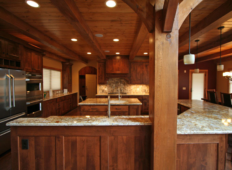 Example of a mountain style kitchen design in Other with stainless steel appliances