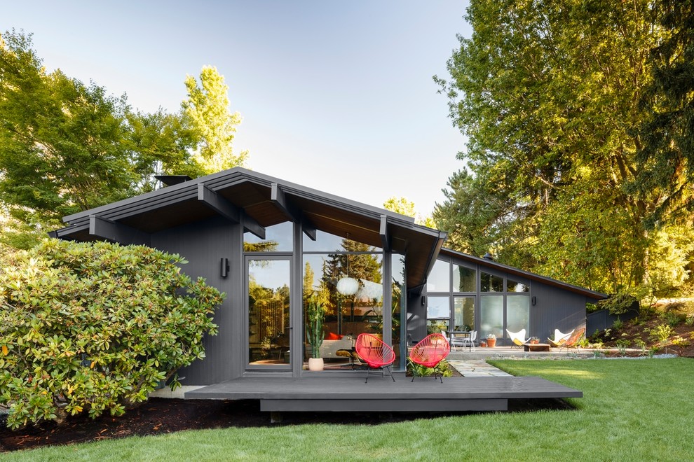 Design ideas for a midcentury one-storey grey house exterior in Portland with a gable roof.
