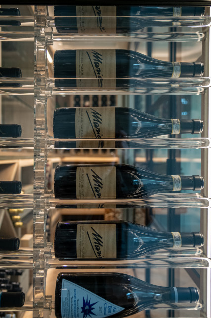 A Wine Cellar with a Black Frame contemporary-wine-cellar