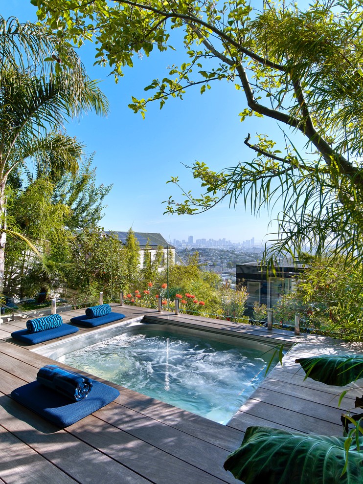 Photo of a contemporary rectangular pool in San Francisco with a hot tub and decking.