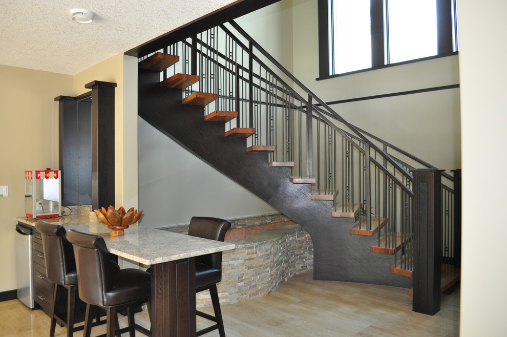 This is an example of a mid-sized arts and crafts wood curved staircase in Edmonton with open risers.