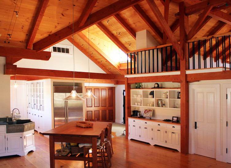 Large transitional l-shaped medium tone wood floor open concept kitchen photo in Boston with a farmhouse sink, beaded inset cabinets, white cabinets and no island