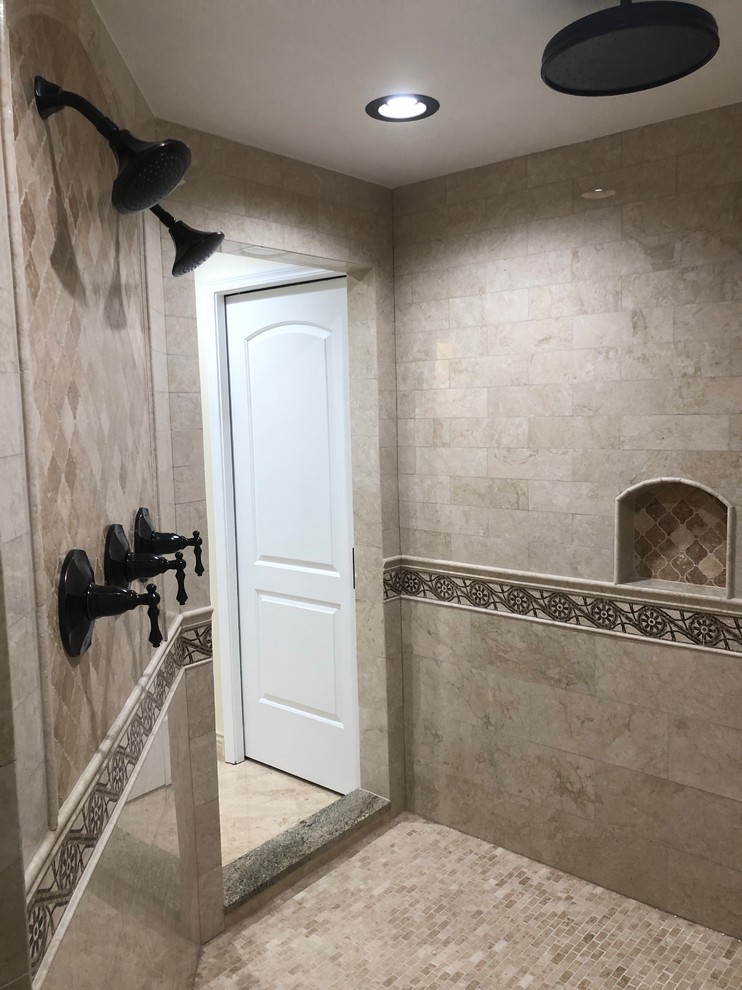 This is an example of an expansive traditional master bathroom in Chicago with an open shower, marble, marble floors, marble benchtops and an open shower.