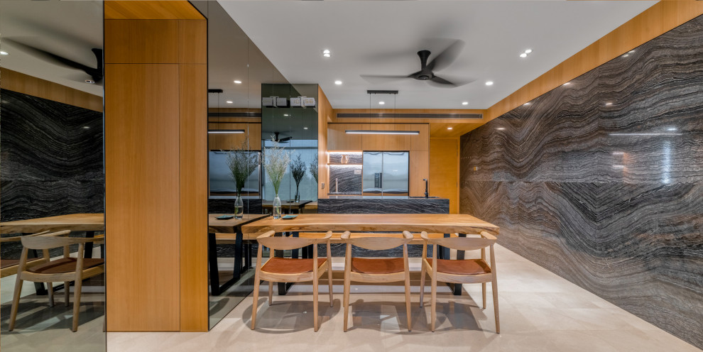 Contemporary dining room in Singapore with grey walls, beige floor and wood walls.
