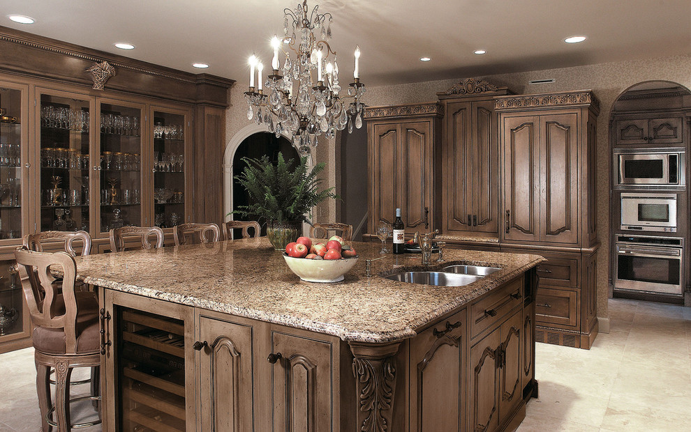 Traditional kitchen in Other with glass-front cabinets, an undermount sink and dark wood cabinets.